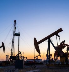 oil,field,,oil,drilling,rig,in,the,evening